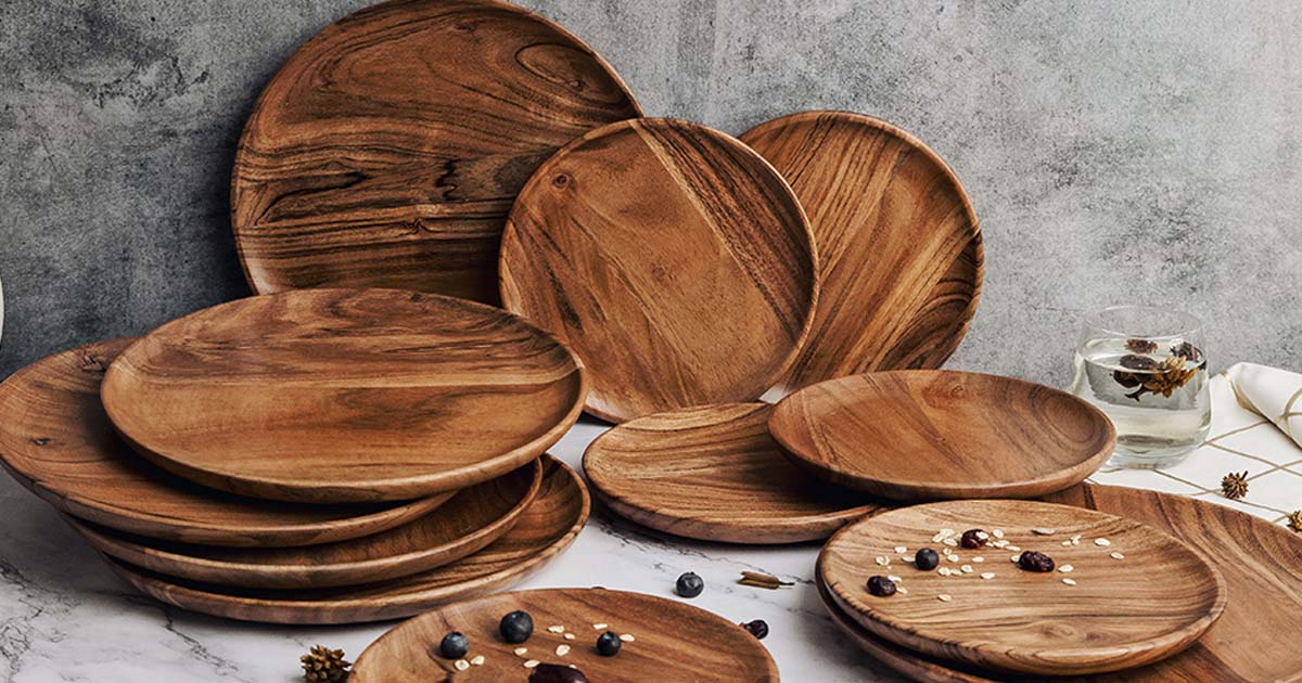 Handcrafted wooden plate on a dining table with natural light